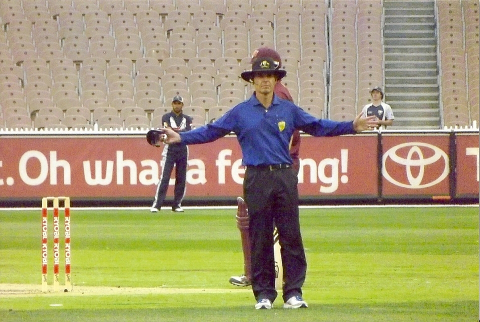 Not as easy as it looks: Umpire Simon Fry signals a wide during a match at the MCG- photo taken by the author